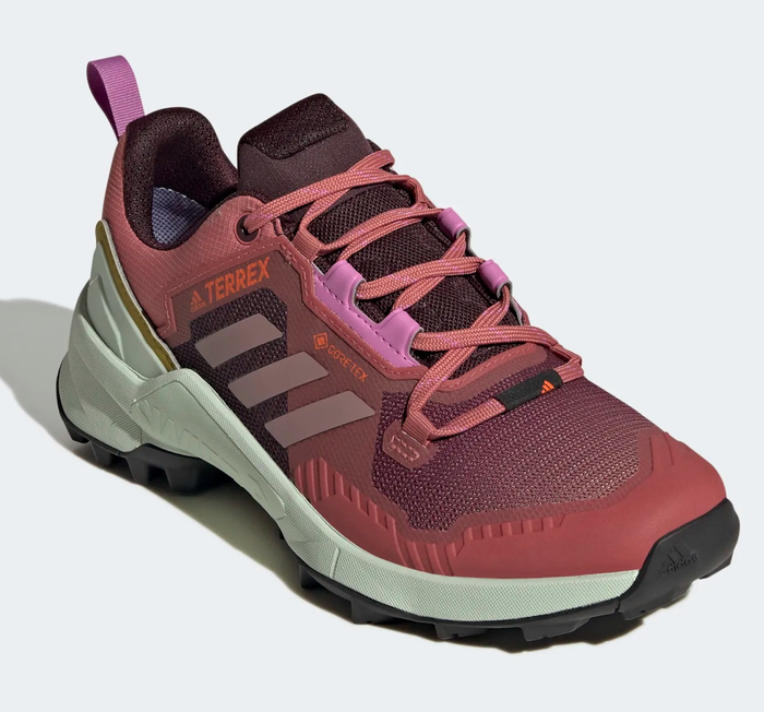 The red and pink Adidas hiking shoes.