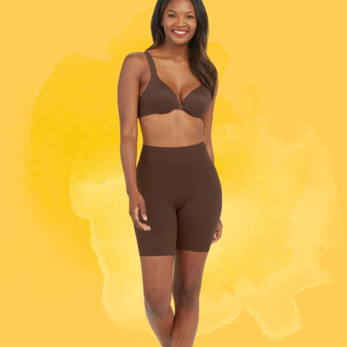 Model wearing the chestnut brown shorts