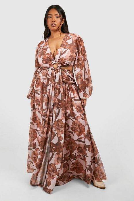 A reviewer in a floral maxi dress featuring a cinched waist, ideal for refreshing your spring wardrobe