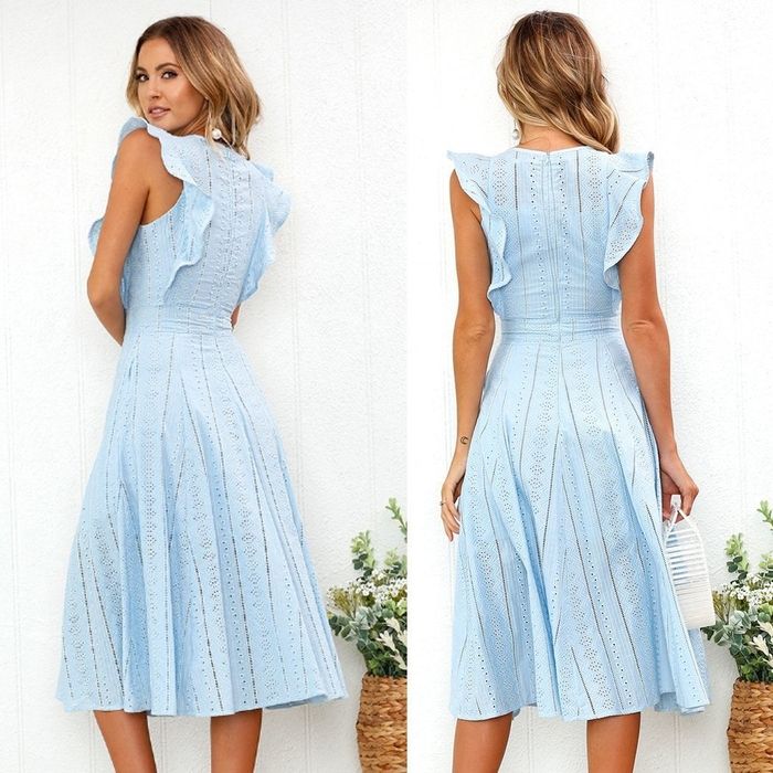 Model elegantly styled in the dress in a striking blue tone