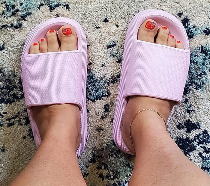 A reviewer wearing the lavender sandals