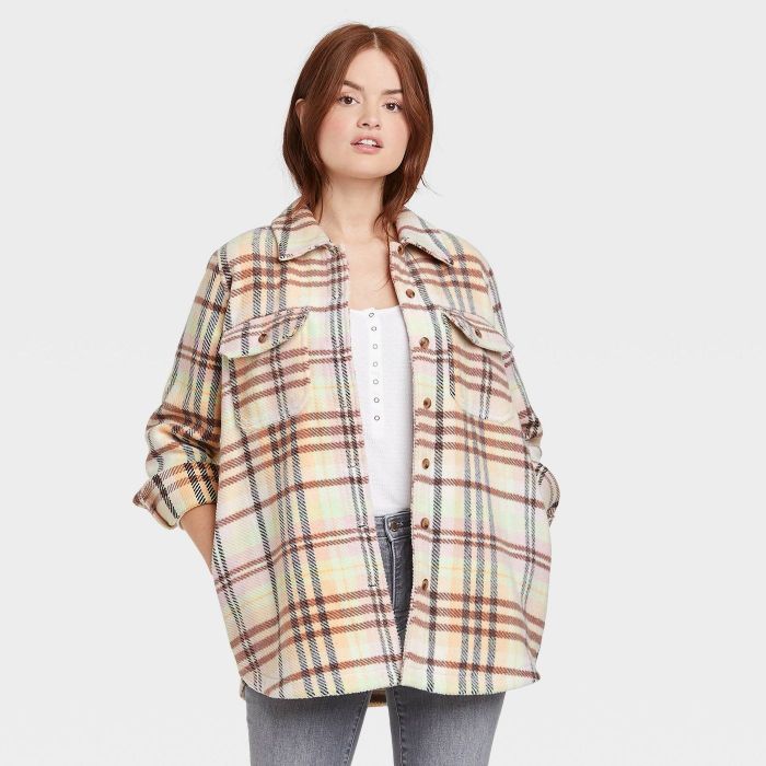 model wearing cream plaid shirt jacket