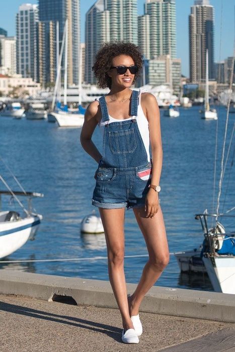 A model styling the American flag overalls