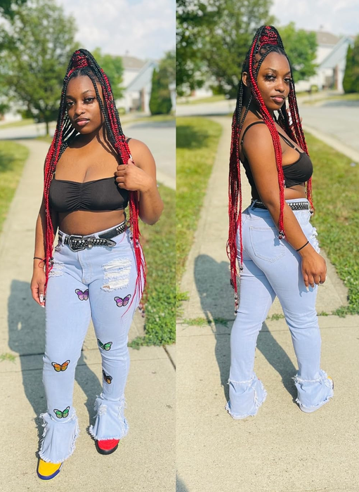 A reviewer styling the butterfly flare jeans