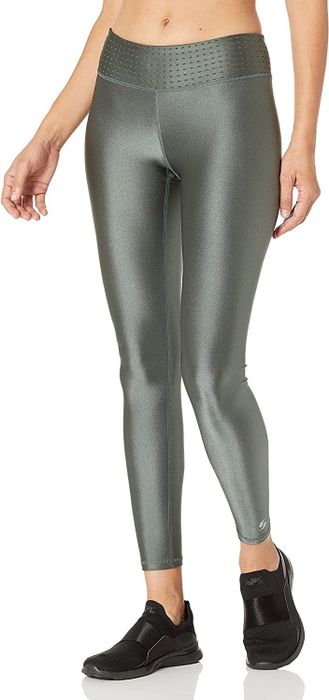 A model showcasing the gray-green shiny leggings
