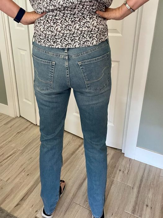 The same reviewer giving a view of the back of the jeans.