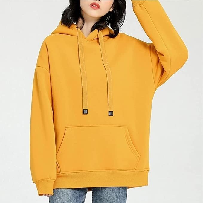 a model wearing the vibrant yellow hoodie