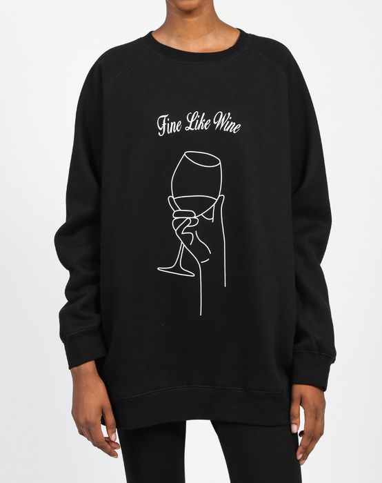 a model showcasing the black version of the sweatshirt