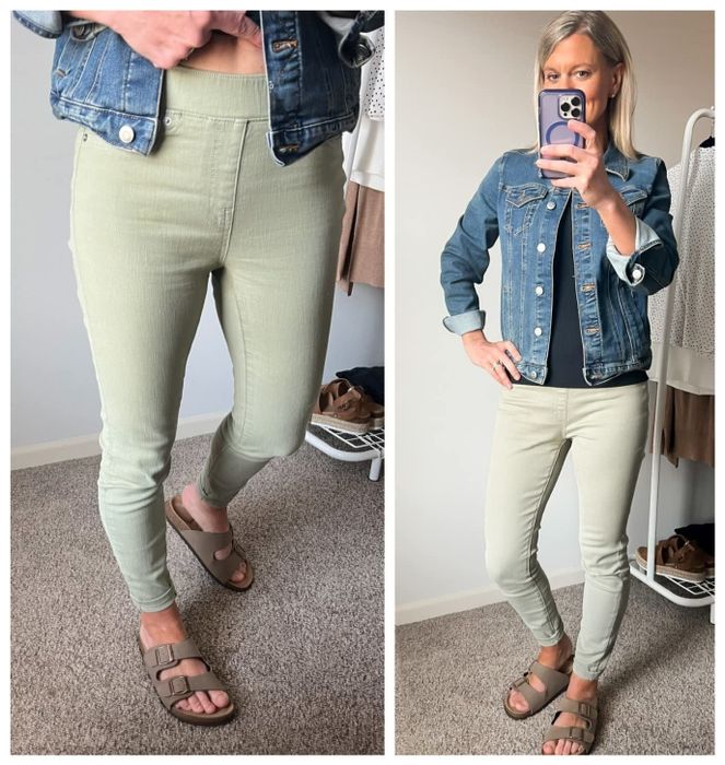 Reviewer wearing light green jeans, a black top, and a denim jacket.