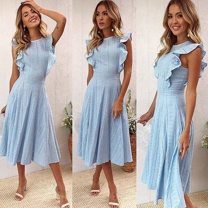 A model showcasing the dress in a lovely shade of blue.