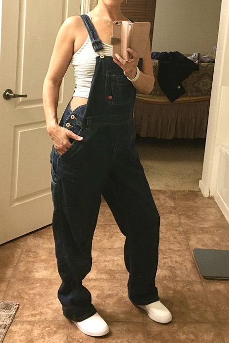 A reviewer dressed in denim overalls