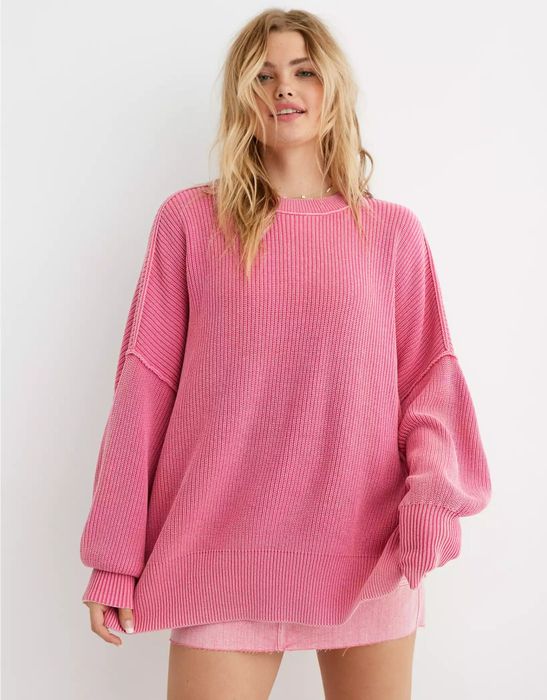 model wearing the pink oversized sweater paired with a pink mini skirt