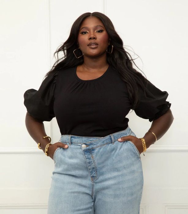 Model wearing a black tee with jeans