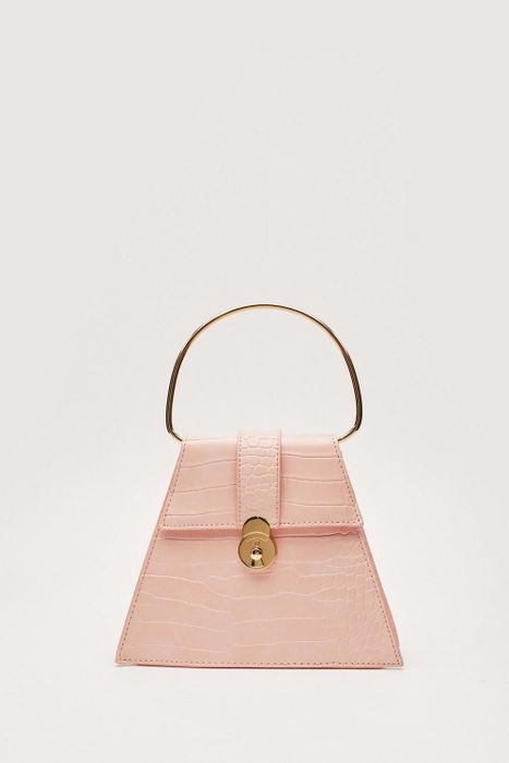 Pink faux crocodile handbag.