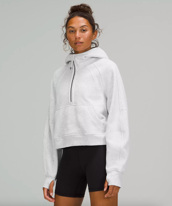 a model wearing the light grey hoodie