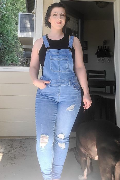 A reviewer wearing light blue overalls