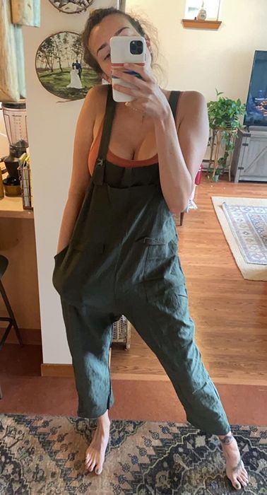 A reviewer styling green overalls
