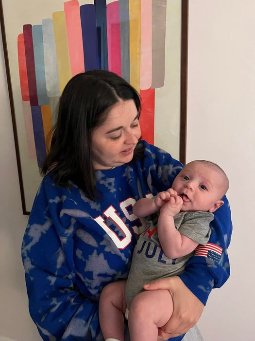 Mytour editor wearing a blue tie-dyed USA sweatshirt