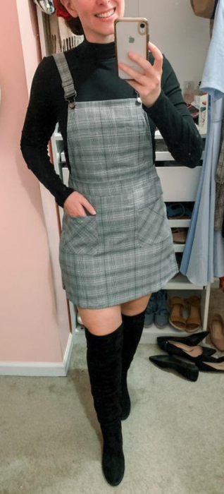 A reviewer styling a gray plaid overall dress