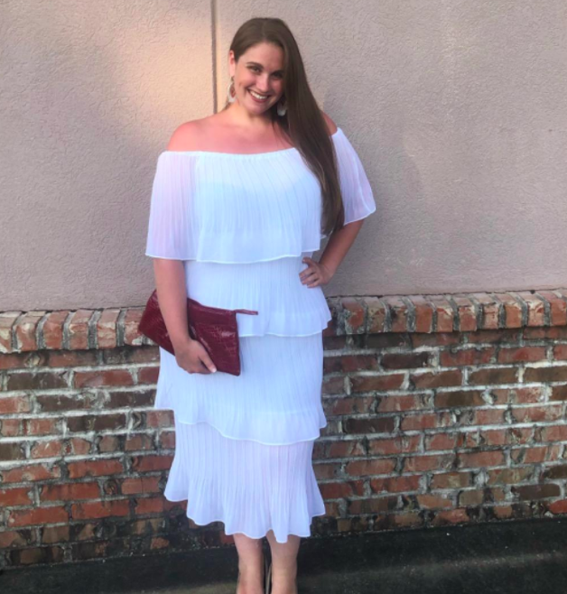 A customer review photo of them wearing the dress in white.