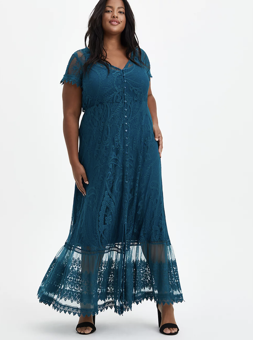 A model wearing a dress with a button-up front.