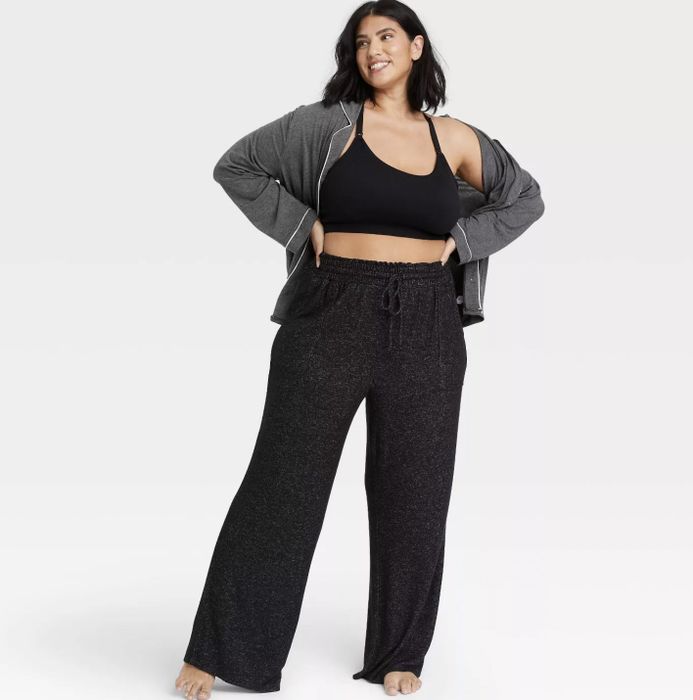 A model wearing black drawstring waist pants