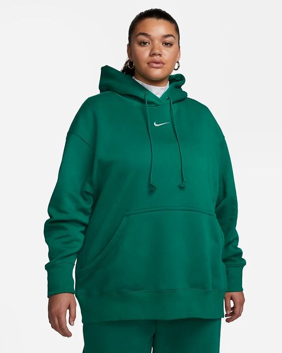 a model wearing the green oversized hoodie