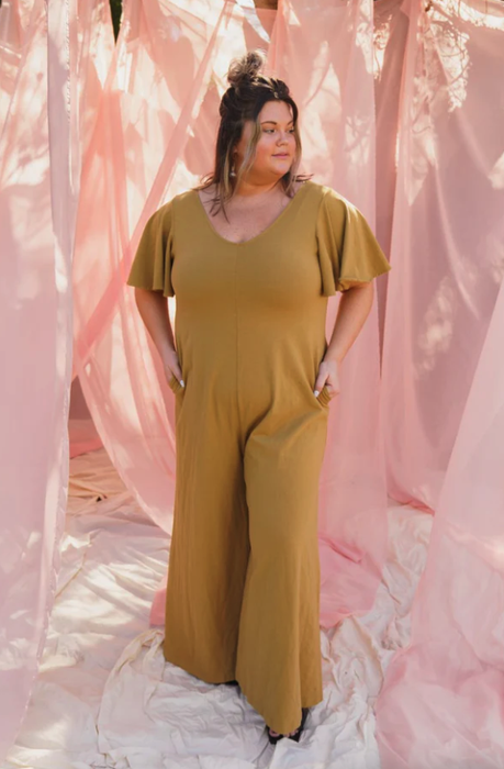 model wearing the mustard jumpsuit