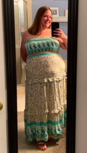A customer review featuring a photo of them wearing the light green dress.