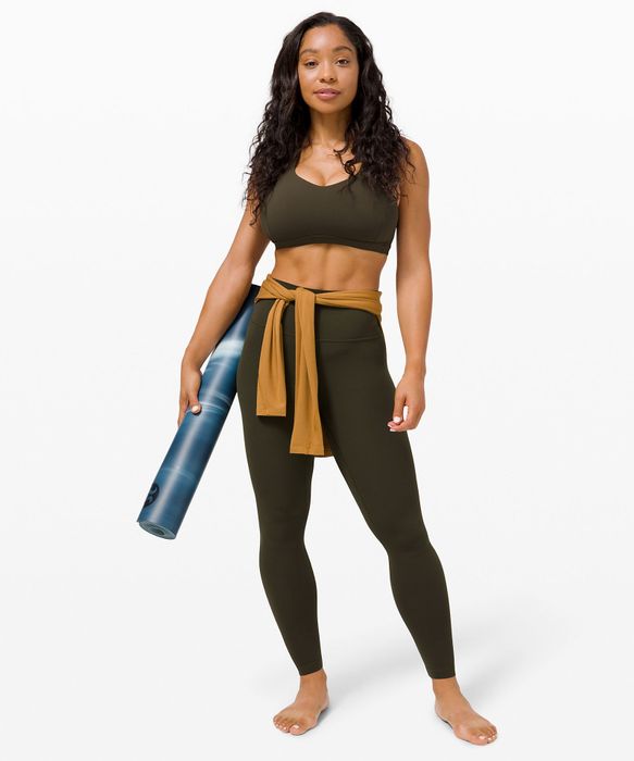 A model wearing the sleek black leggings
