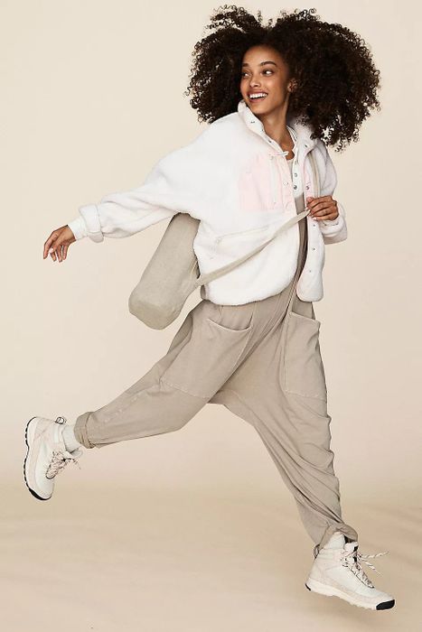 a model showcasing the grey onesie