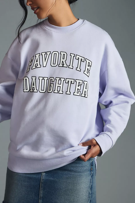 a model wearing the lilac sweatshirt