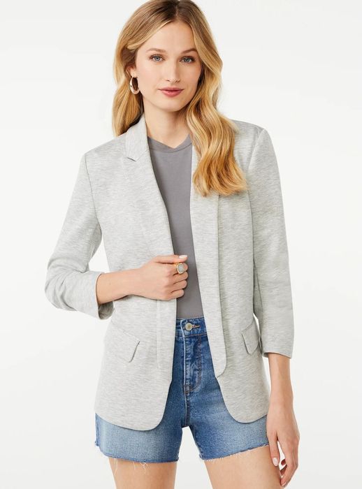 Model wearing a gray blazer