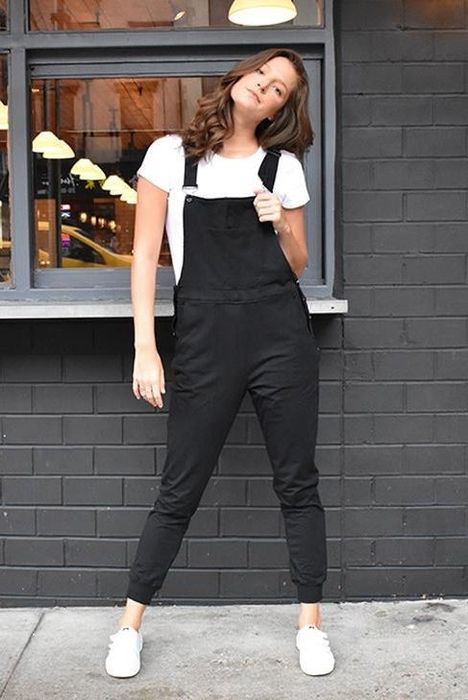 A model showcasing black overalls