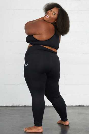 A model styled in black leggings