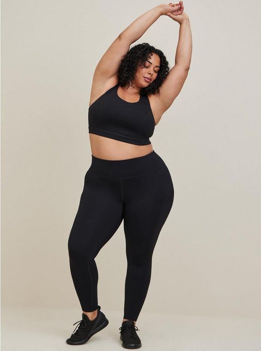 A model wearing high-waisted black leggings