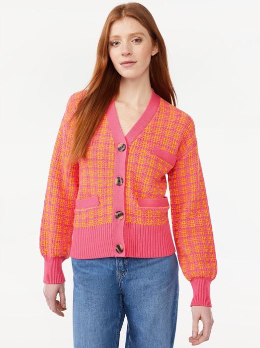 Model showcasing a tweed cardigan sweater featuring welt pockets