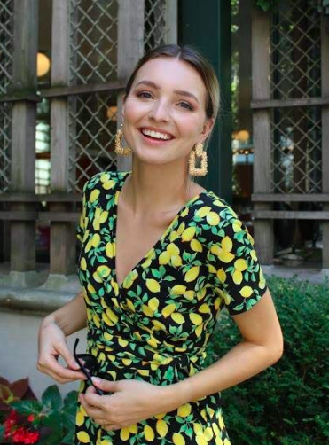 reviewer wearing a dress with a lemon print