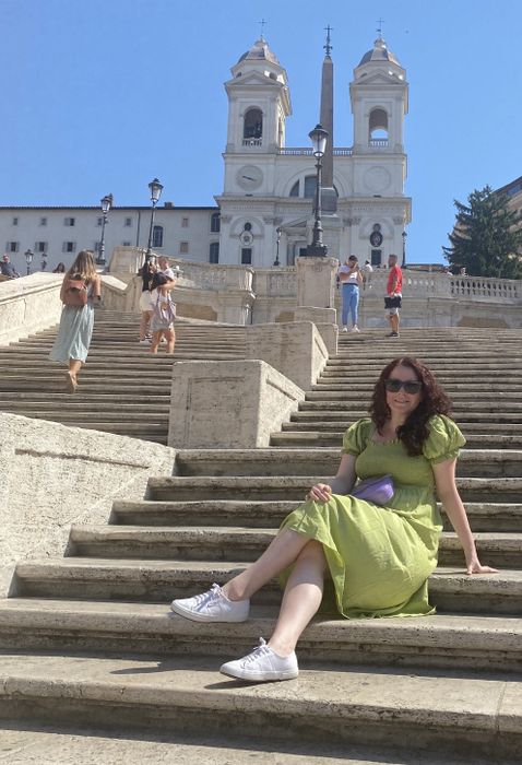The writer wearing the dress, seated on the Spanish Steps in Rome