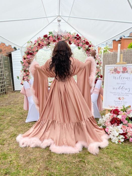 customer image of the same reviewer standing and showcasing the back of their custom pink Yinyyinhs feather robe