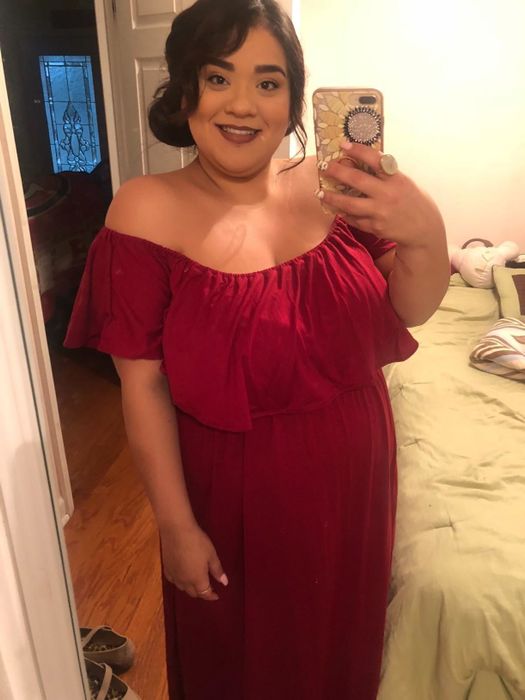 a reviewer sharing a mirror selfie in the red off-the-shoulder maxi dress