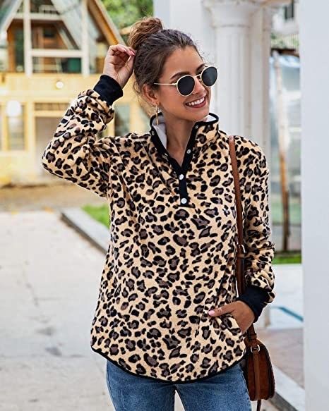 A model showcasing a leopard print pullover fleece