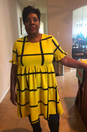 A reviewer photo of the dress in a yellow plaid pattern