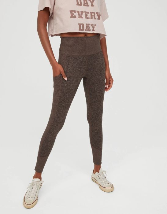model in brown partially ribbed leggings with their hand in one of the thigh pockets