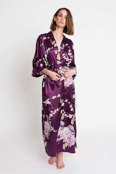 a model showcasing the KIM+ONO satin kimono robe in the plum Chrysanthemum & Crane design