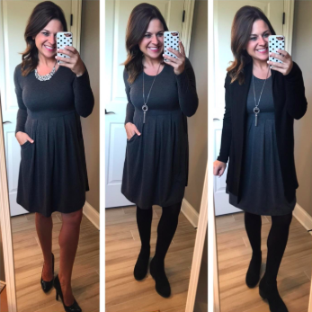 A reviewer wearing a long-sleeve navy dress with pockets