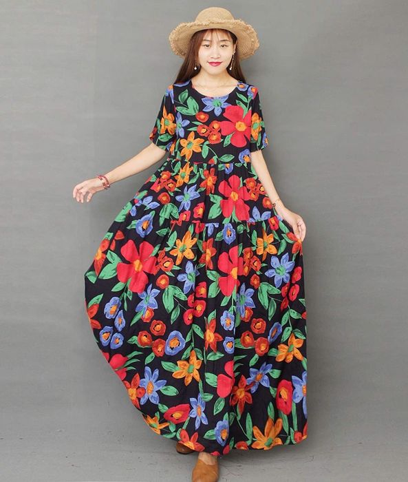 model wearing a long, colorful floral dress