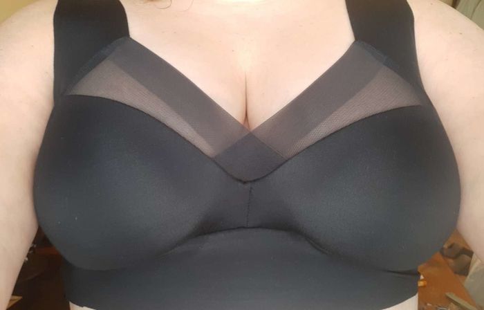 customer image of a plus-size reviewer wearing the black Plunge Bralette