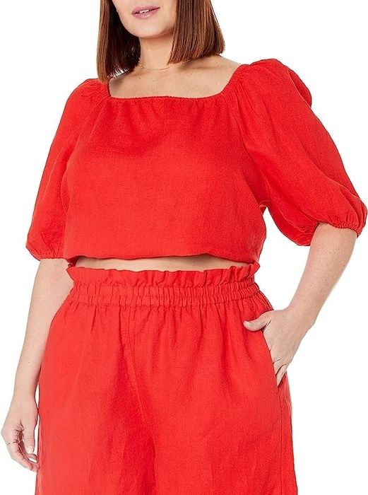 The model is sporting the same red square-neck top.