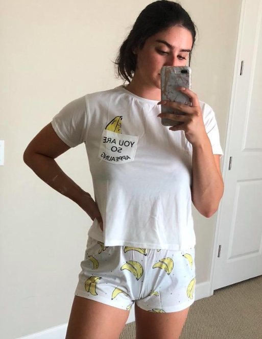 customer image of a reviewer taking a mirror selfie in the Banana Didk cartoon print pajama set